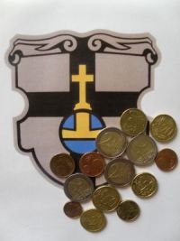 Foto zeigt das Wappen der Stadt Meckenheim mit darauf liegenden Geldmünzen